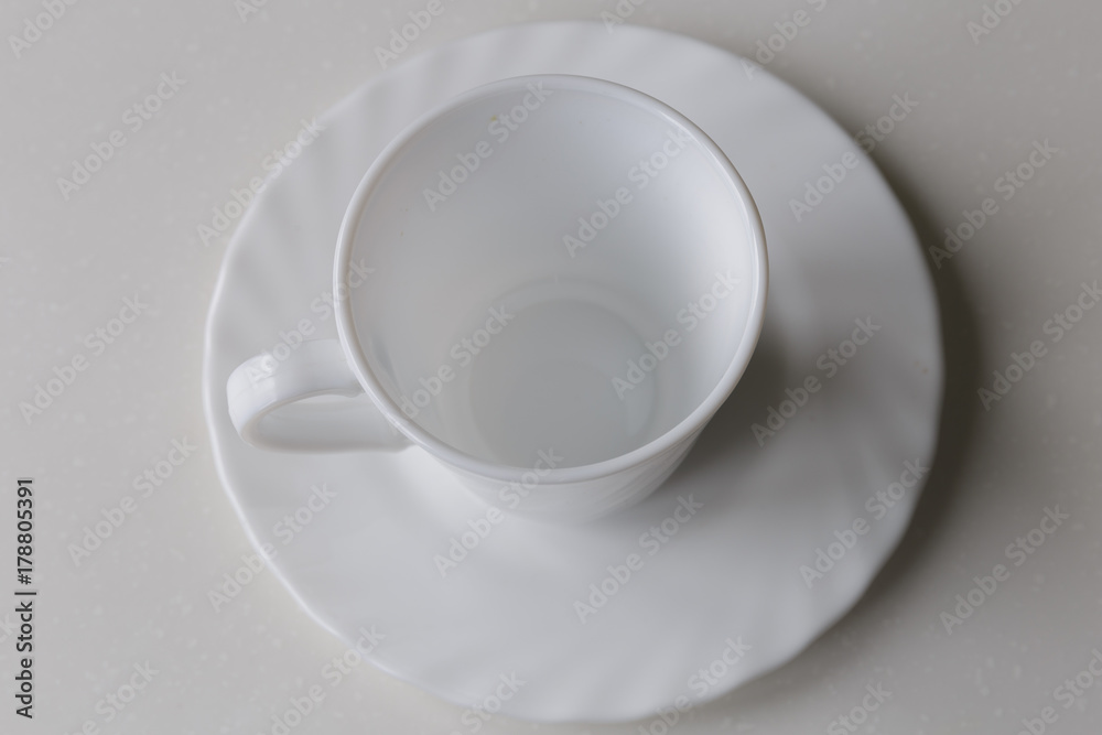 Fototapeta premium Top view of empty coffee cup and saucer. Crockery for coffee and tea.