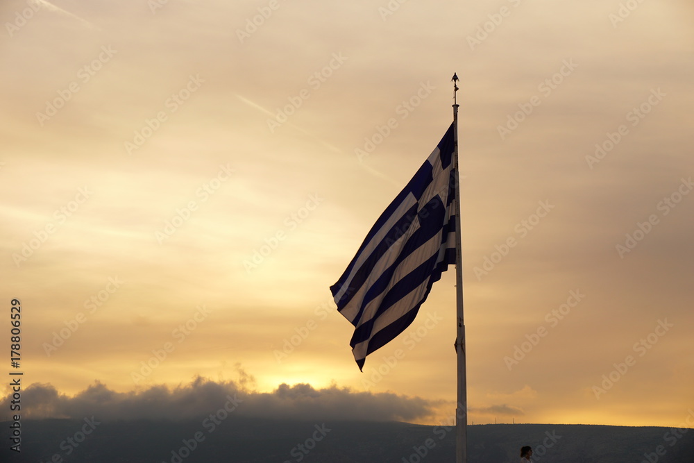 Greek Flag with gorgeous Sunset Sky Background