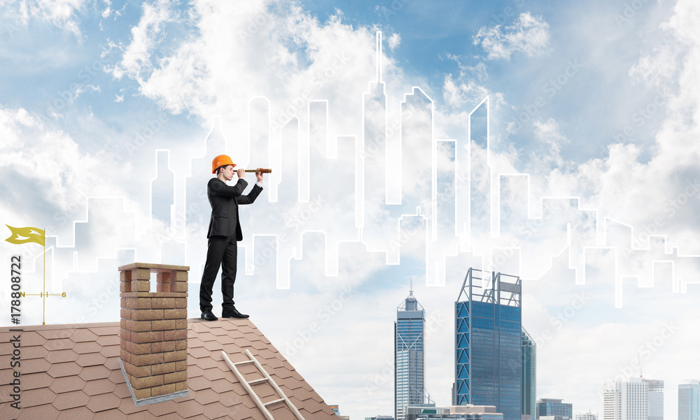 Engineer man standing on roof and looking in spyglass. Mixed media Engineer man standing on roof and looking in spyglass. Mixed media