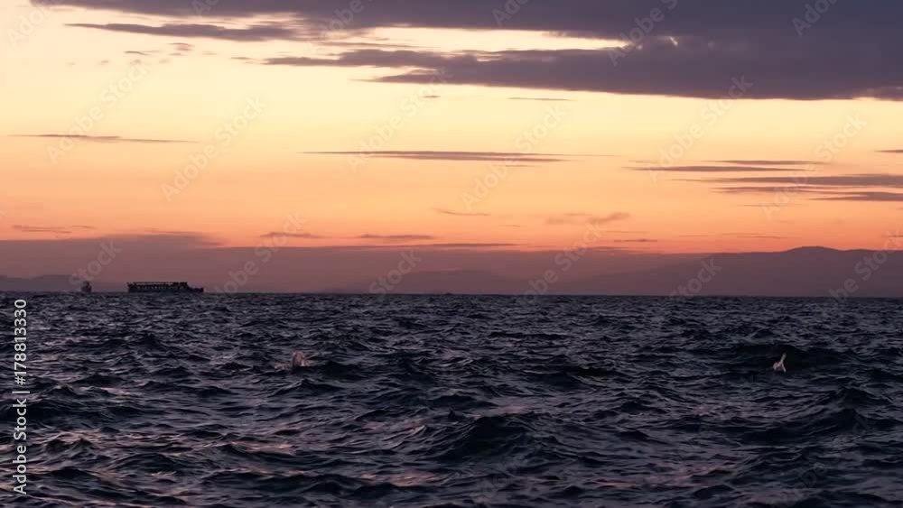 ship passing by the sea at sunset ship passing by the sea at sunset