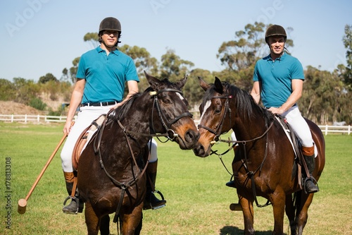 Two male jockeys riding horse in the ranch © WavebreakMediaMicro