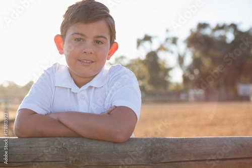 Boy smiling at camera in the ranch