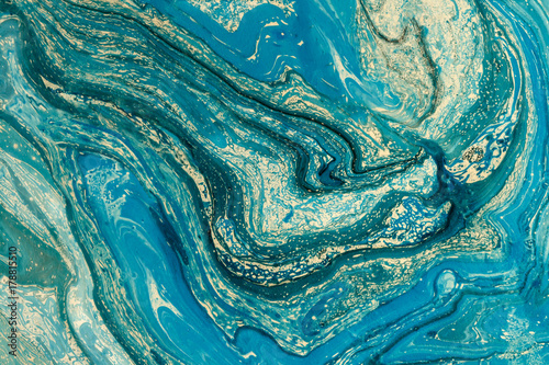 Abstract creative background with blue marbling oil painted surface. Liquid paint.