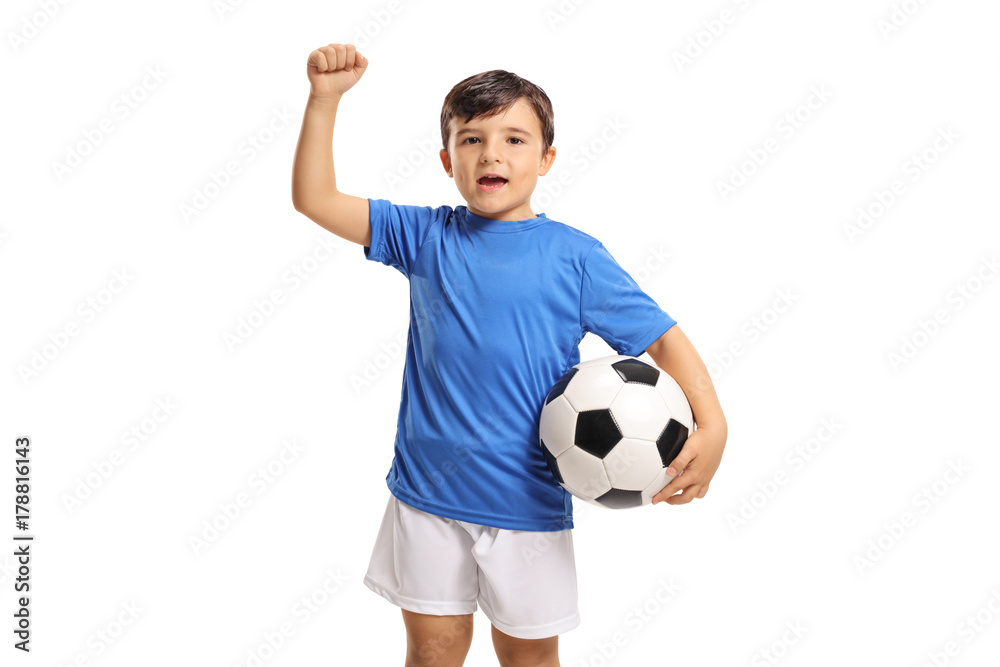 Joyful little footballer gesturing with his hand