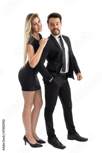 Portrait of elegant couple. Posing for the photo. Man and woman wear black. Full body.