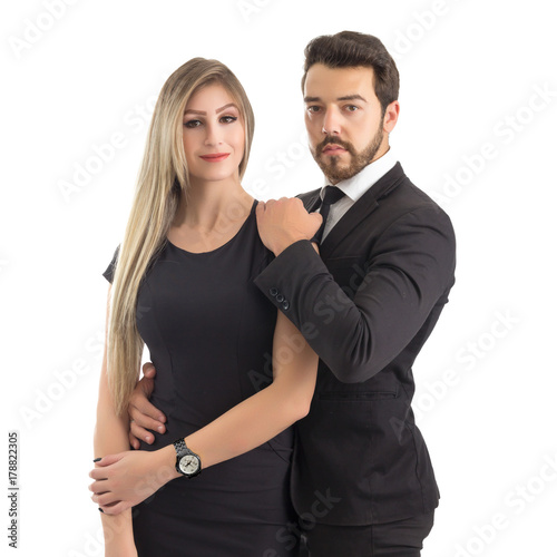 Portrait of elegant couple. Posing for the photo. Man and woman wear black..