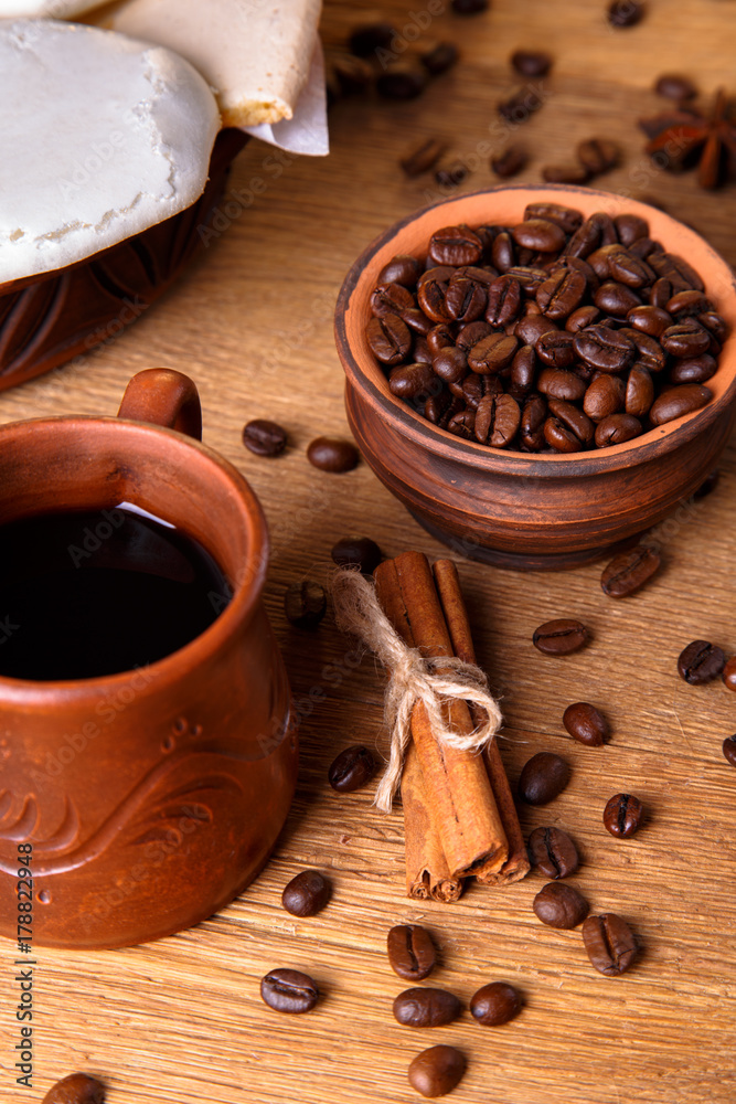 grains of black coffee on the wooden table grains of black coffee on the wooden table