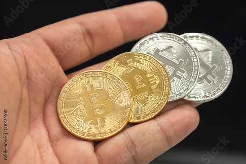 hand holding bitcoin