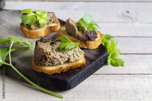 liver pate with toast on a  Board