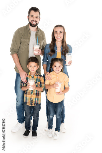 family holding milkshakes