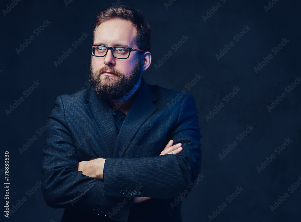 Fototapeta premium Serious plump male in eyeglasses over grey background.