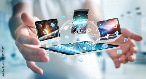 Businessman connecting tech devices to each other 3D rendering