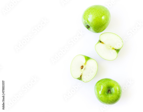 Closeup top view green apple on white background with space for product or text advertising, fruit healthy concept photo