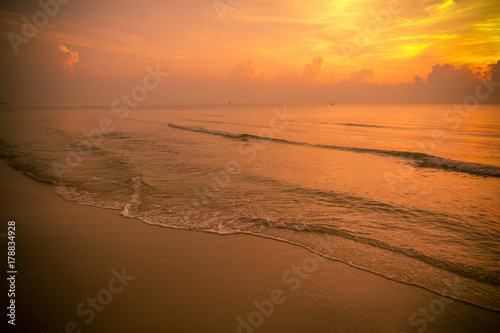 Golden sun set in tropical hot summer beach in thailand, golden special effect.