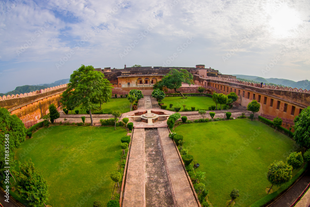 Beautiful indoor garden of the ancient indian palace in Amber fort in Rajasthan in Jaipur India, fish eye effect