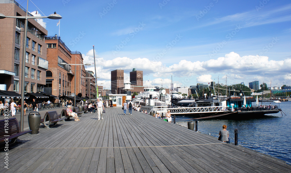 View of city hall (radhus), wooden pier, sunny day, Oslo, Norway