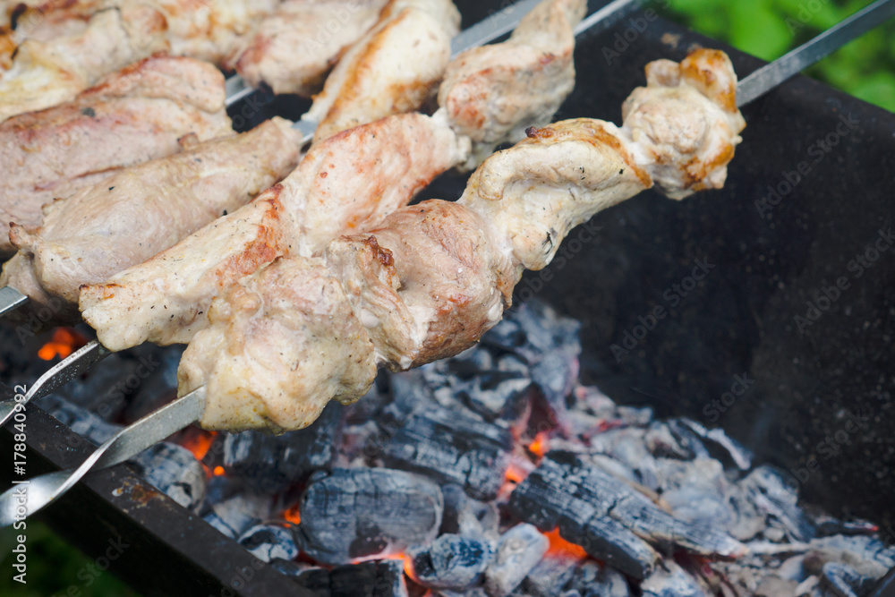 Chicken grilling on the brazier. Selective focus. Chicken grilling on the brazier. Selective focus.