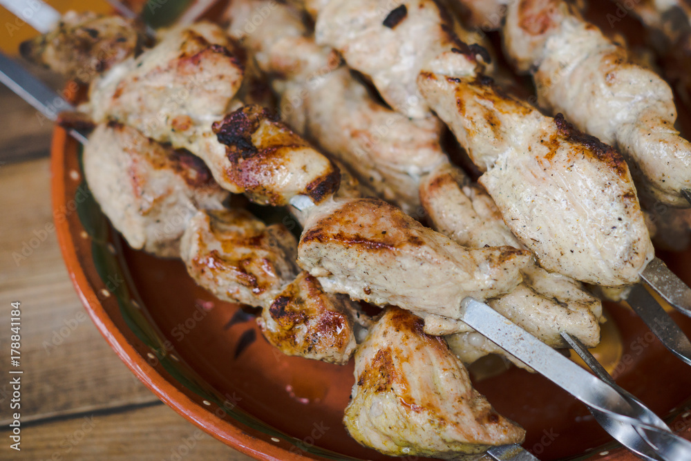 Chicken grilling on the brazier. Selective focus. Chicken grilling on the brazier. Selective focus.