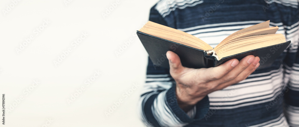 Fototapeta premium Man holding bible.