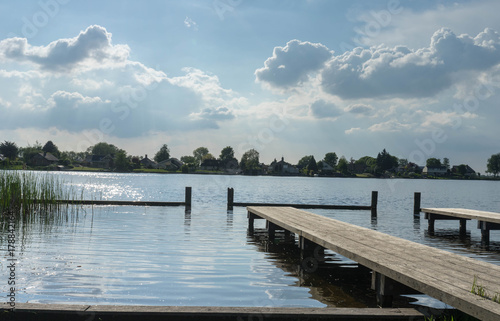 Pontoon and lake in Zwartsluis, in the Weerribben-Wieden National Park, near Giethoorn,  Netherlands © adellyne