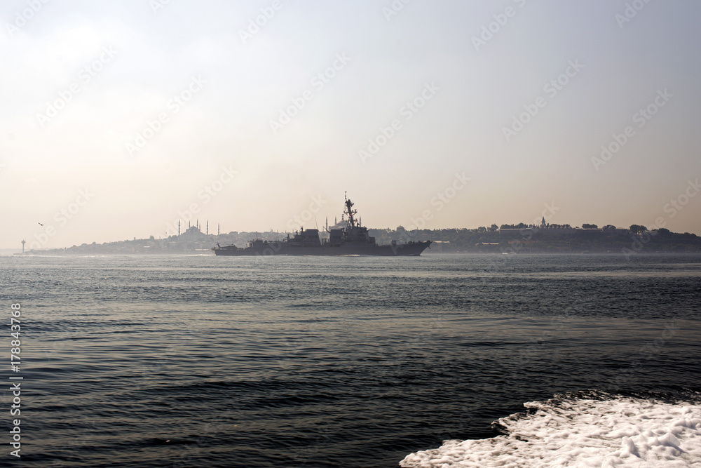 A skyline of Istanbul and a warship in the sea of Marmara