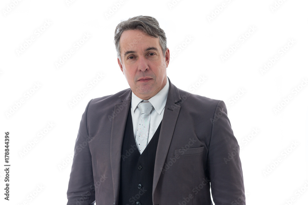 Gray haired man looks seriously. He has gray hair and social clothing.. Gray haired man looks seriously. He has gray hair and social clothing..
