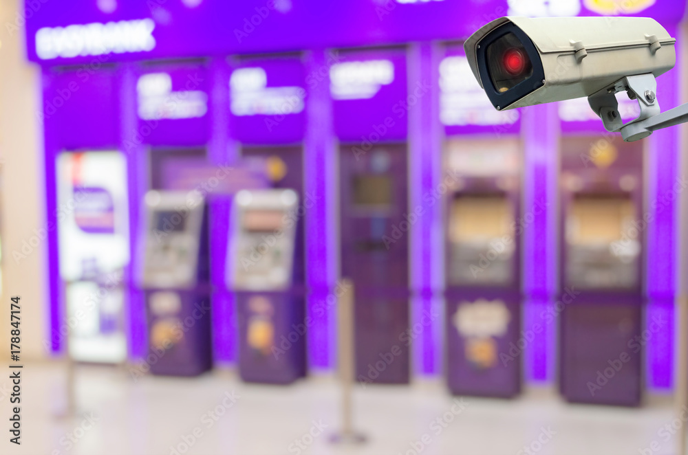 CCTV, security indoor camera system operating in front of ATM banking machine at bank, surveillance security and safety technology concept