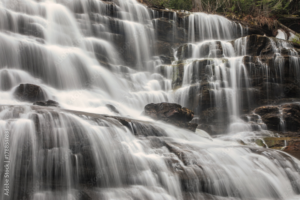 Water cascading down a series of waterfalls in British Columbia