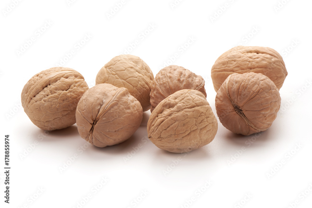 Walnuts close-up, isolated on white background Walnuts close-up, isolated on white background