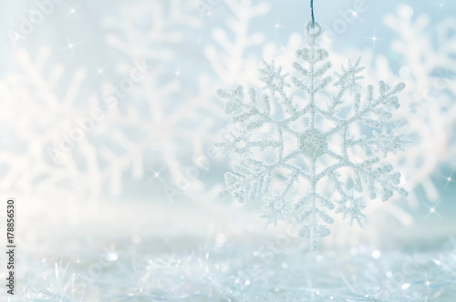 Snowflake on a blue festive background. Beautiful Christmas background photo