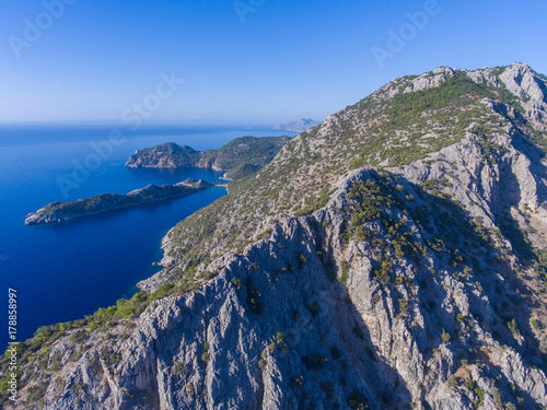 The rocky coast of Turkey and the Mediterranean sea. photo