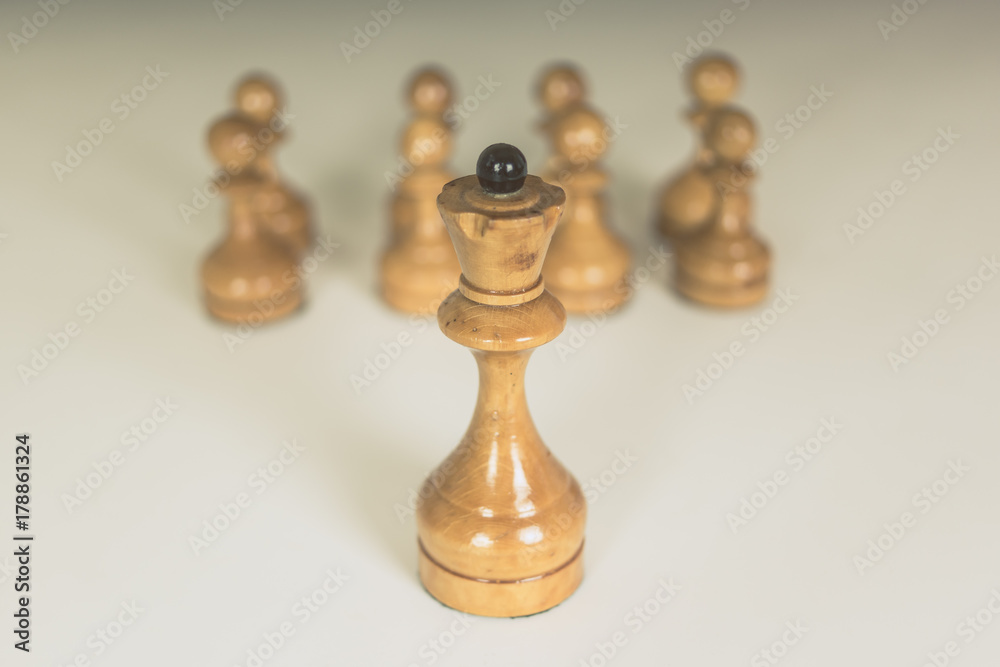 Simple old chess pieces - white queen and pawns Simple old chess pieces - white queen and pawns