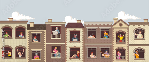Windows with cartoon people. Buildings in the city.
