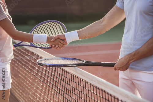 Couple playing tennis