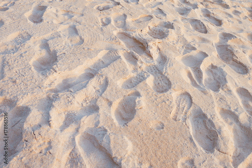 shoe print on sand at the beach