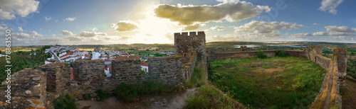 Terena castle overlooking the village at the end of the day photo