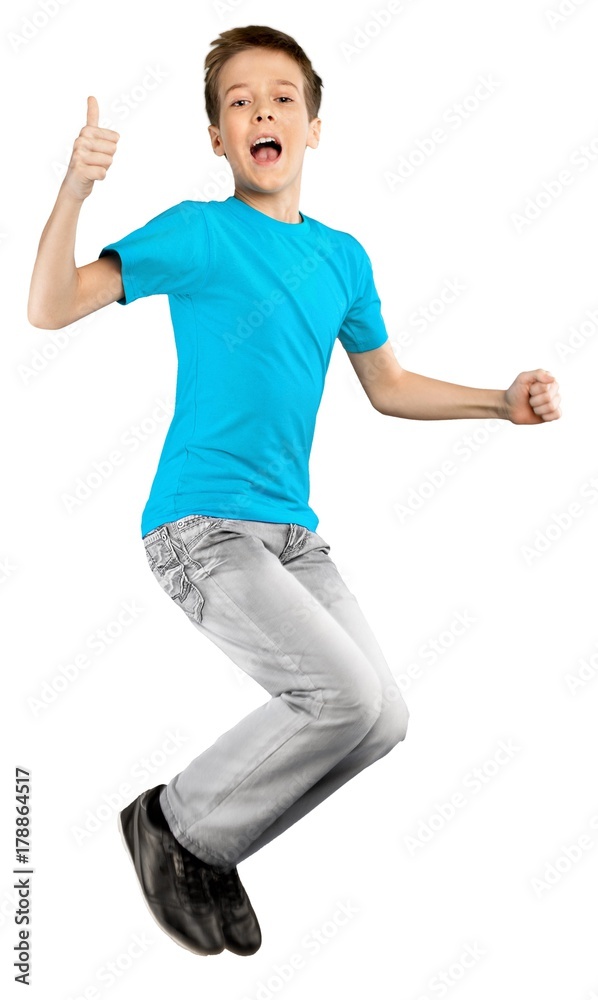 Young Kid Jumping for Joy Showing Thumbs Up Young Kid Jumping for Joy Showing Thumbs Up