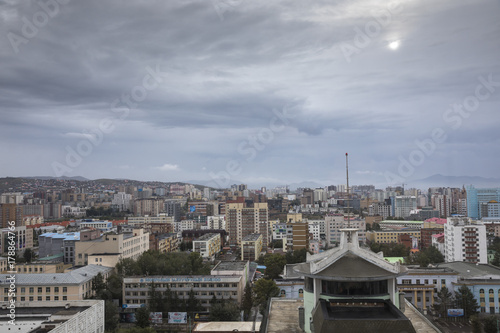 city of Ulaanbaatar, Mongolia, with a cloudy sky over it 