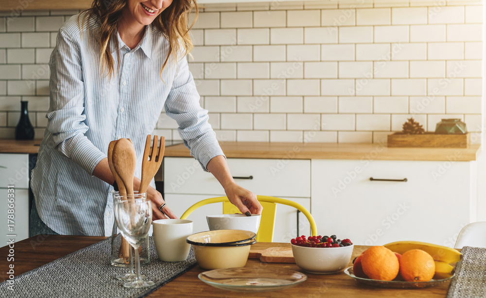 Funny young housewife cooking in kitchen Stock Photo - Alamy