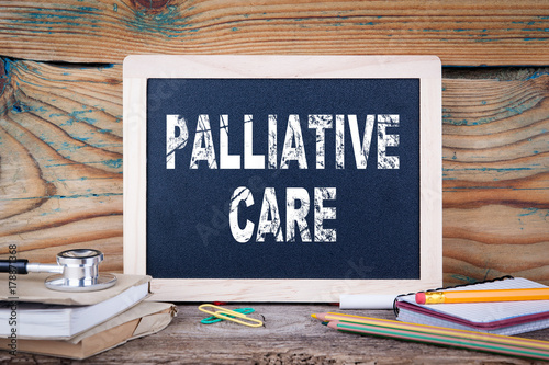 Fotografia palliative care. health and safety. Chalk board Background.