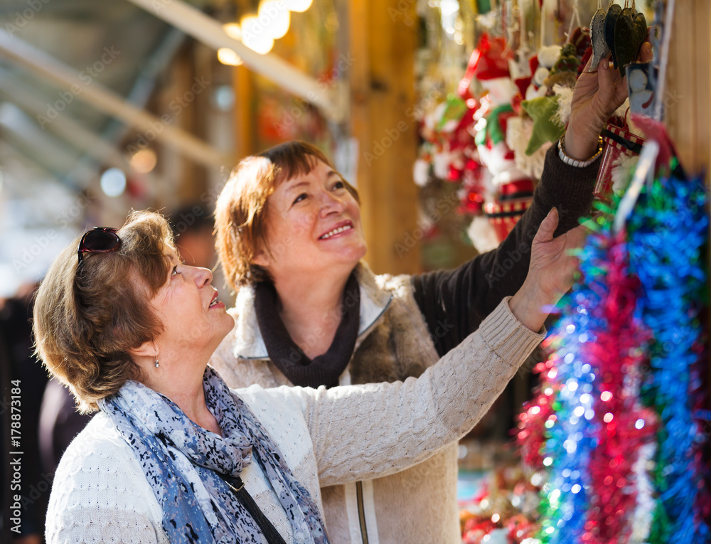 Female pensioners buying X-mas decorations