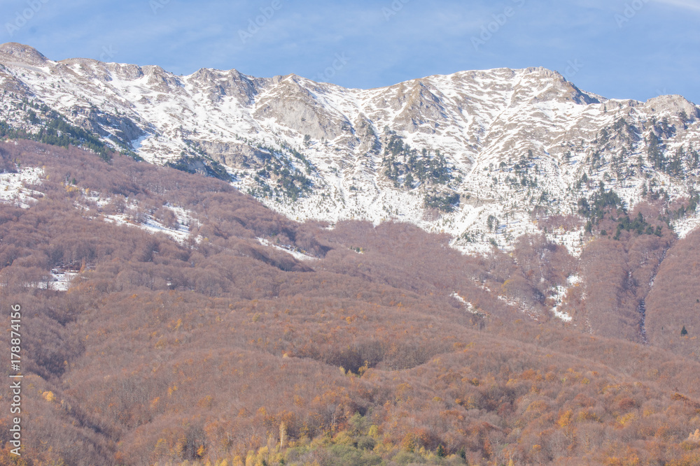 Mountains covered with snow in early Autumn days