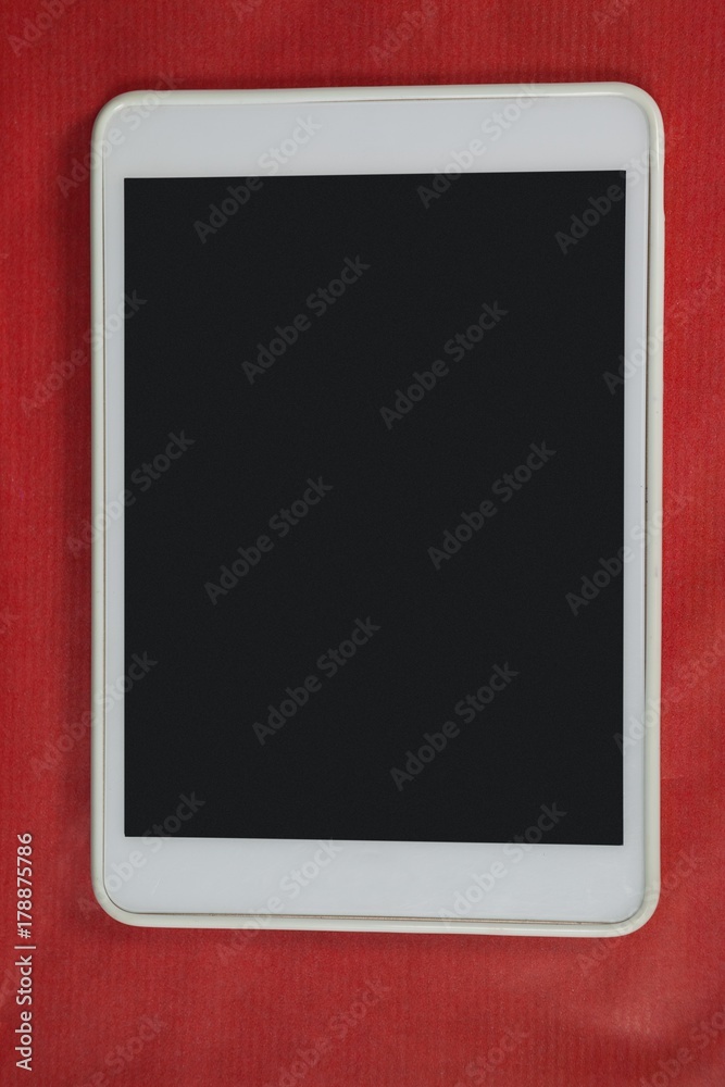 Digital tablet on red background Digital tablet on red background