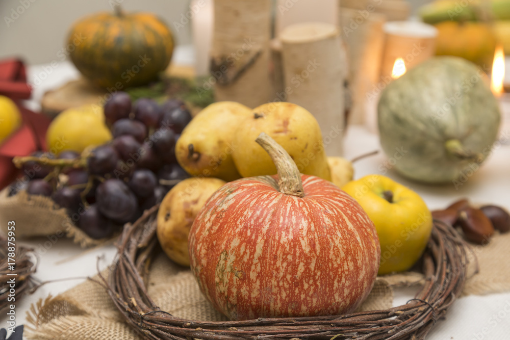Autumn arrangement with tasty pears,quince, pumpkins and candles. Autumn arrangement with tasty pears,quince, pumpkins and candles.