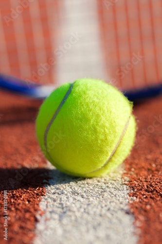 Tennis Racket and Ball on a Tennis Court