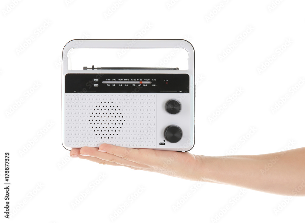 Fototapeta premium Woman holding radio on white background