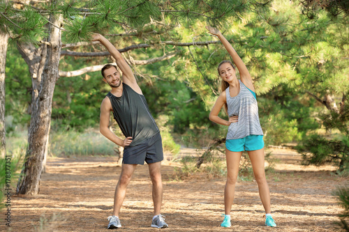 Young man and woman doing e...
