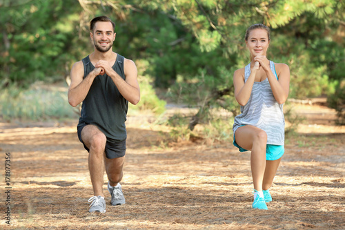 Young man and woman doing e...