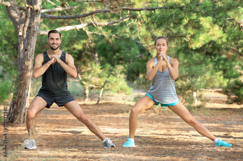Young man and woman doing e...