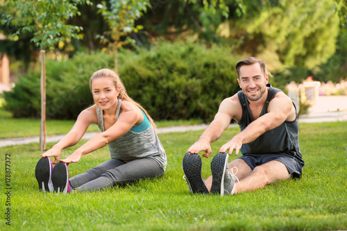 Young man and woman doing e...